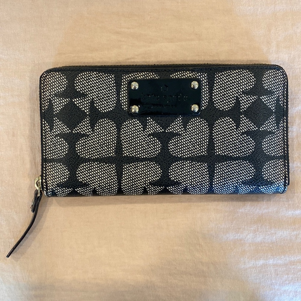 Kate Spade long zipper wallet. Black and white with red silk interior.